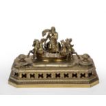 An antique Austrian gilt metal desk stand adorned with Poseidon and four hippocampus and inkwells,