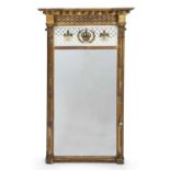 An early 19th century gilded pier glass in the neoclassical style, with a reverse glass printed