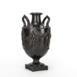 A late 18th century Wedgwood and Bentley basalt vase decorated with cherubs, having a Wedgwood and