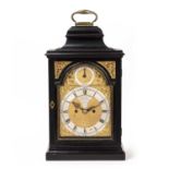 An 18th century ebonised bracket clock, Samuel Swain, London. Surmounted by a brass handle, fish