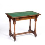 A Victorian Pugin style oak side table by Gillows of Lancaster, having a single frieze drawer,