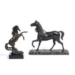 A 20th century bronze sculpture depicting a rearing horse on a black marble plinth, overall 14cm x