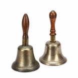 An early 19th century 11 inch hand bell with a turned walnut handle, 14.5cm diameter, 28cm high,