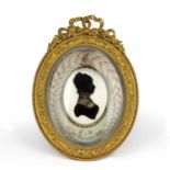 A 19th century mourning silhouette initialled I S and dated 24th November 1838 with a lock of
