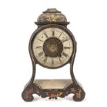 A late 18th/early 19th century French black japanned bracket clock with silvered Roman chapter ring,