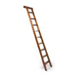 An early 20th century stained pine library ladder 61cm wide x 245cm highIn good condition, with some