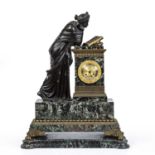 A substantial 19th century French figural bronze and marble mantel clock with gilt mounts and paw