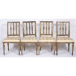 A set of four 19th century Continental gilded hardwood dining chairs each with three splats,