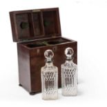 A George III mahogany twin bottle decanter box with a brass swan neck handle and two cut glass