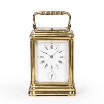 A 19th century French brass carriage clock, the white enamel Roman dial with Arabic five minutes and