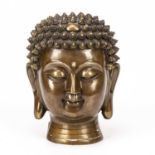 A 20th century Eastern gilt metal buddha bust 19cm wide x 24cm highIn good condition