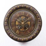 A late 19th century oak dial clock with applied brass Roman chapters, leaf carved and polychrome