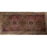 Kelim rug of red ground with traditional geometric designs, 323cm x 153cm (approx)The construction