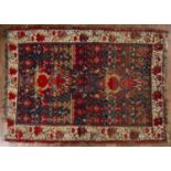 Kurdish Hamadan rug Iranian decorated to the centre with two central flower pots, surrounded by