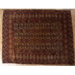 Turkmen Tekke rug 20th Century decorated with 27 medallions to the centre with further ones to the