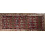 Kelim rug of black ground, with geometric designs, 415cm x 151cm (approx)With some wear and holes.