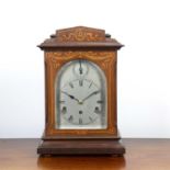 Striking mantel clock Edwardian, in an inlaid satinwood and mahogany case, with a silvered dial