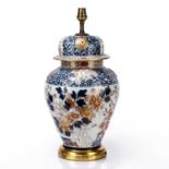 Japanese Arita polychrome vase and cover 18th Century, with underglaze decoration in blue and raised