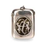 Victorian silver and enamel vesta case of plain rectangular form, with enamel family crest of