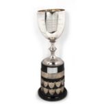 Victorian silver trophy cup with accompanying presentation base, cup inscribed "Cheltenham Spa music