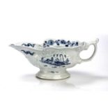 Worcester sauce boat porcelain, circa 1753-55, painted with the 'Crowded Island' pattern, with