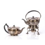 Three piece silver tea set consisting of a teapot with ebonised handle, and a kettle on stand (