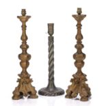 Pair of gilt painted wooden candlesticks of knopped form on tripod base, 55cm high including the