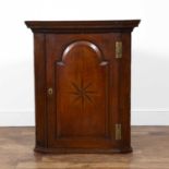 Oak corner cupboard 19th Century, fitted shelves, and with star inlaid door, 90cm wide x 107cm