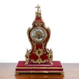 Red tortoiseshell mantel clock 19th Century, with gilt metal mounts, and white enamel Roman