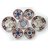 Two Japanese Imari porcelain chargers 29.5cm diameter, and five 19th/early 20th Century Japanese