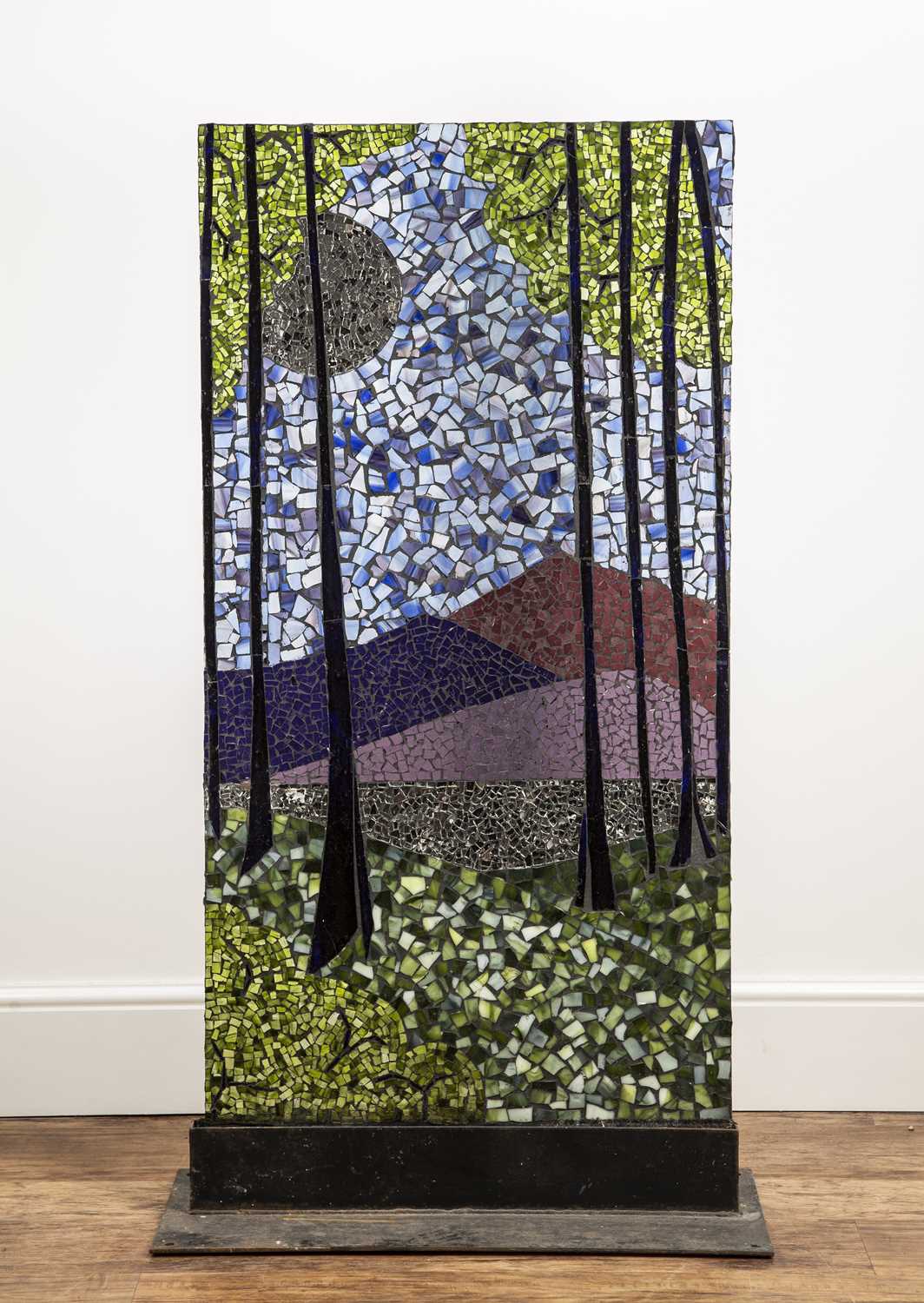 Large mosaic glass panel on a metal stand depicting trees and river scene, unsigned, 126cm high