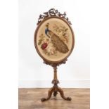 Walnut fire screen Victorian, with a tapestry panel of a peacock in wool threads, on a tripod