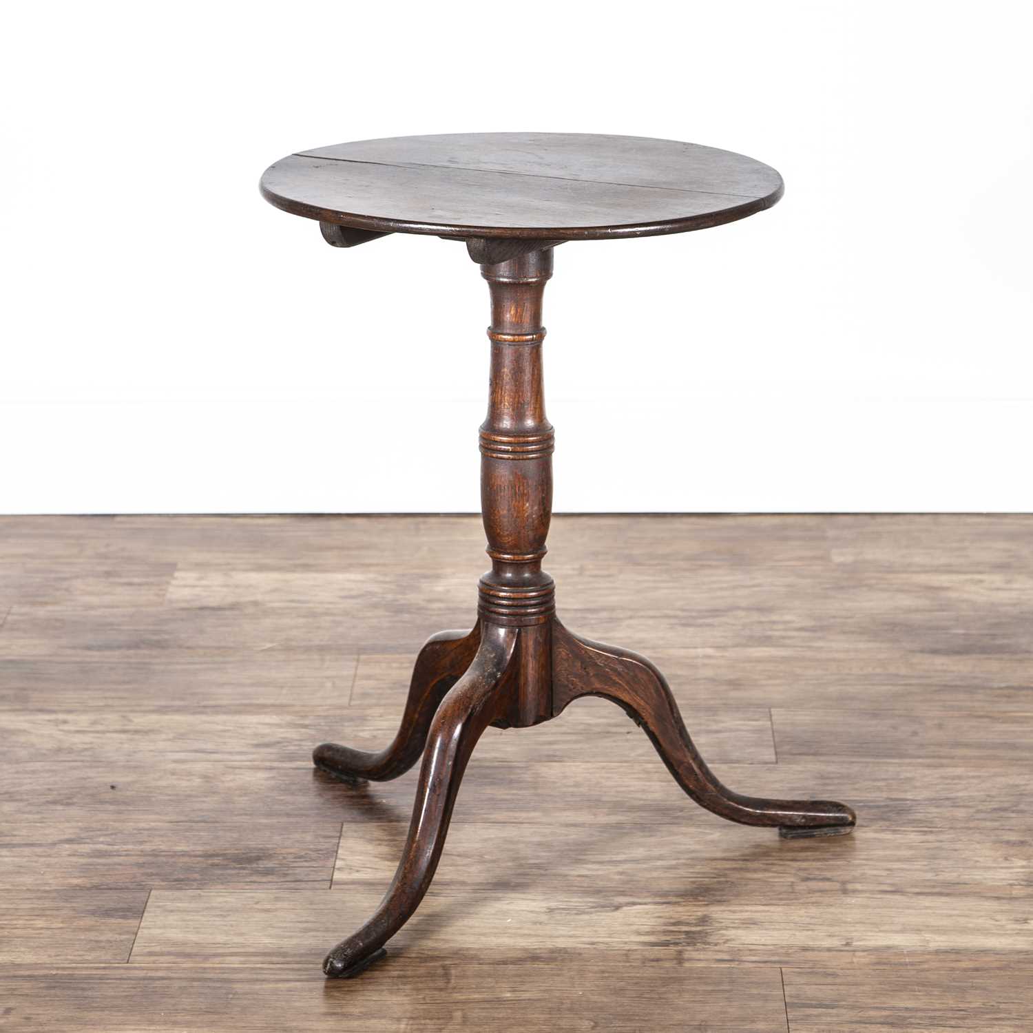 Oak tripod table late 18th/early 19th Century, with a circular top, 49.5cm x 47.5cm x 68cmThe top is