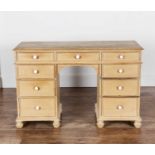 Pine dressing table fitted with nine drawers, having porcelain handles, 115cm wide x 47.5cm deep x