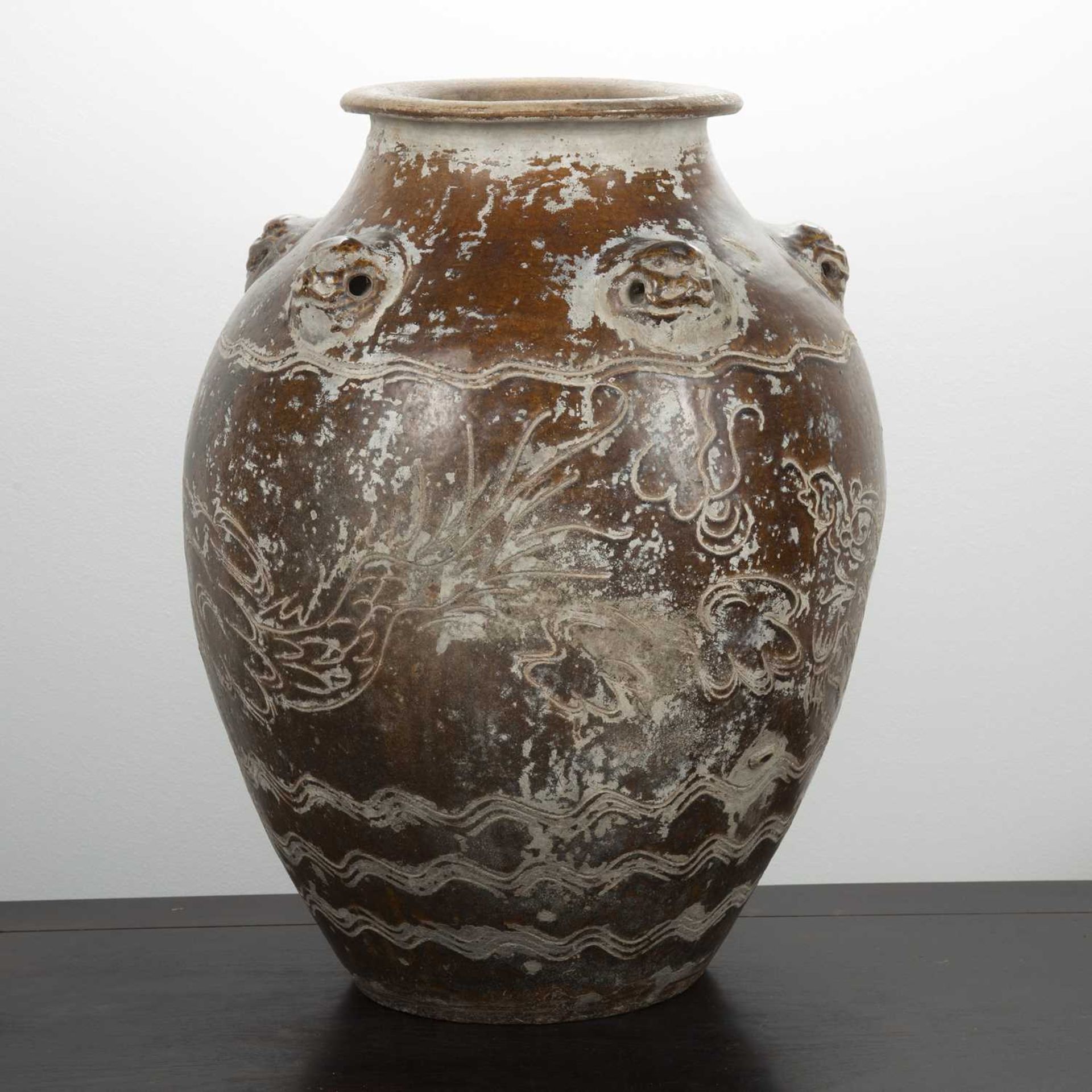 Large treacle glazed storage jar Chinese, 17th/18th Century having five mask handles around the - Image 4 of 5