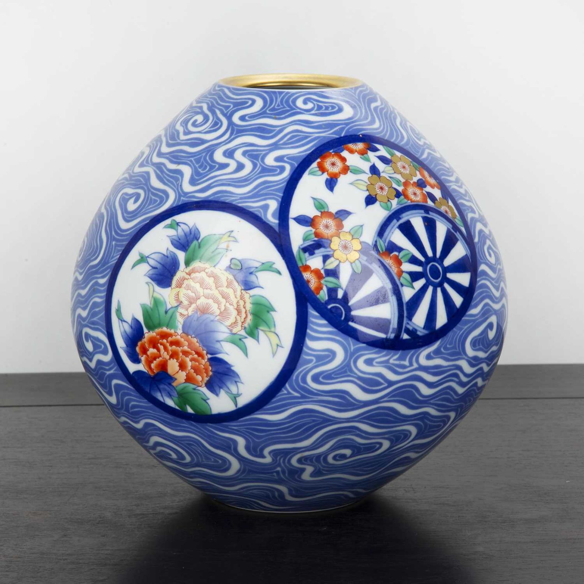 Fukagawa vase Japanese, 20th Century decorated with circular panels depicting flowers, with a blue