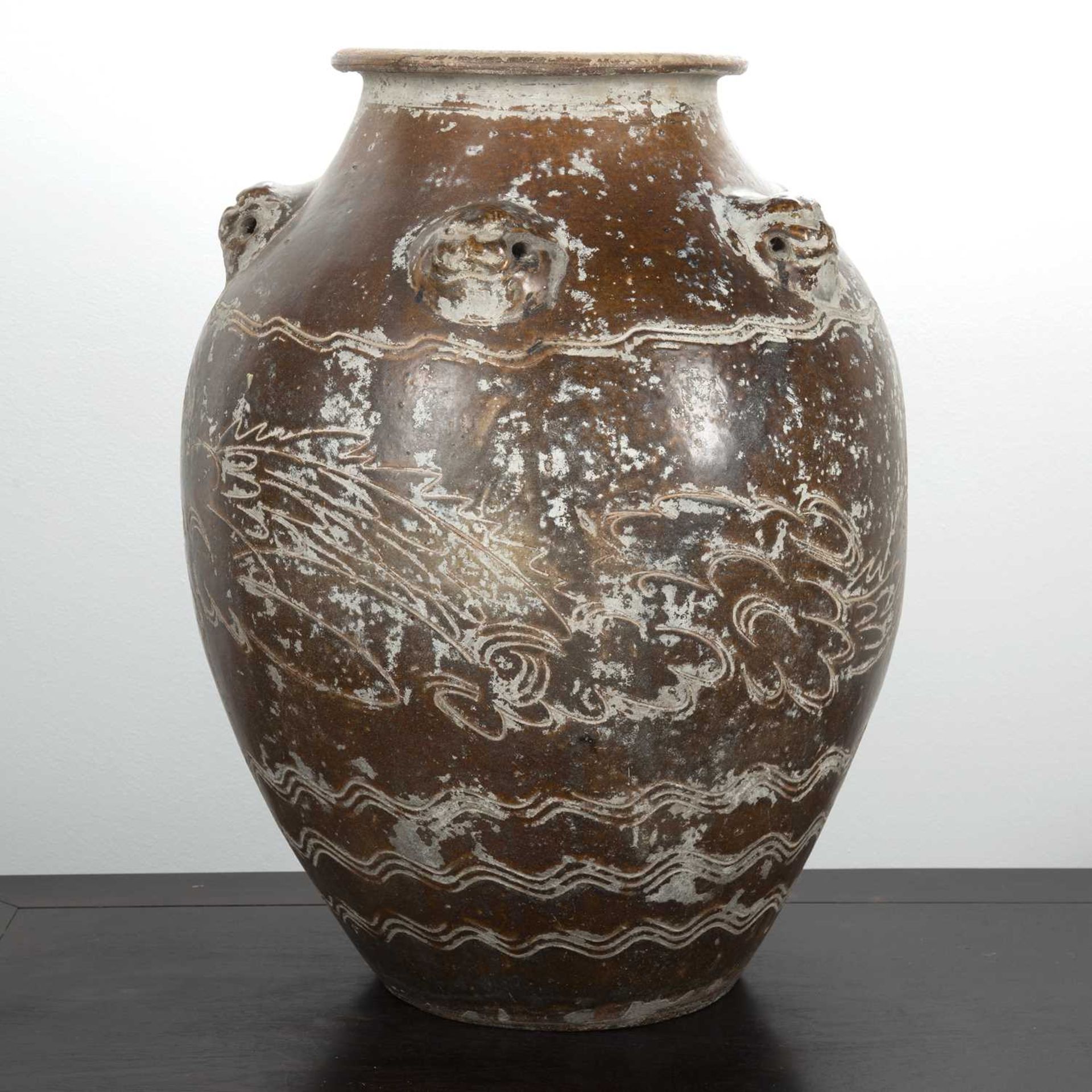 Large treacle glazed storage jar Chinese, 17th/18th Century having five mask handles around the - Image 3 of 5