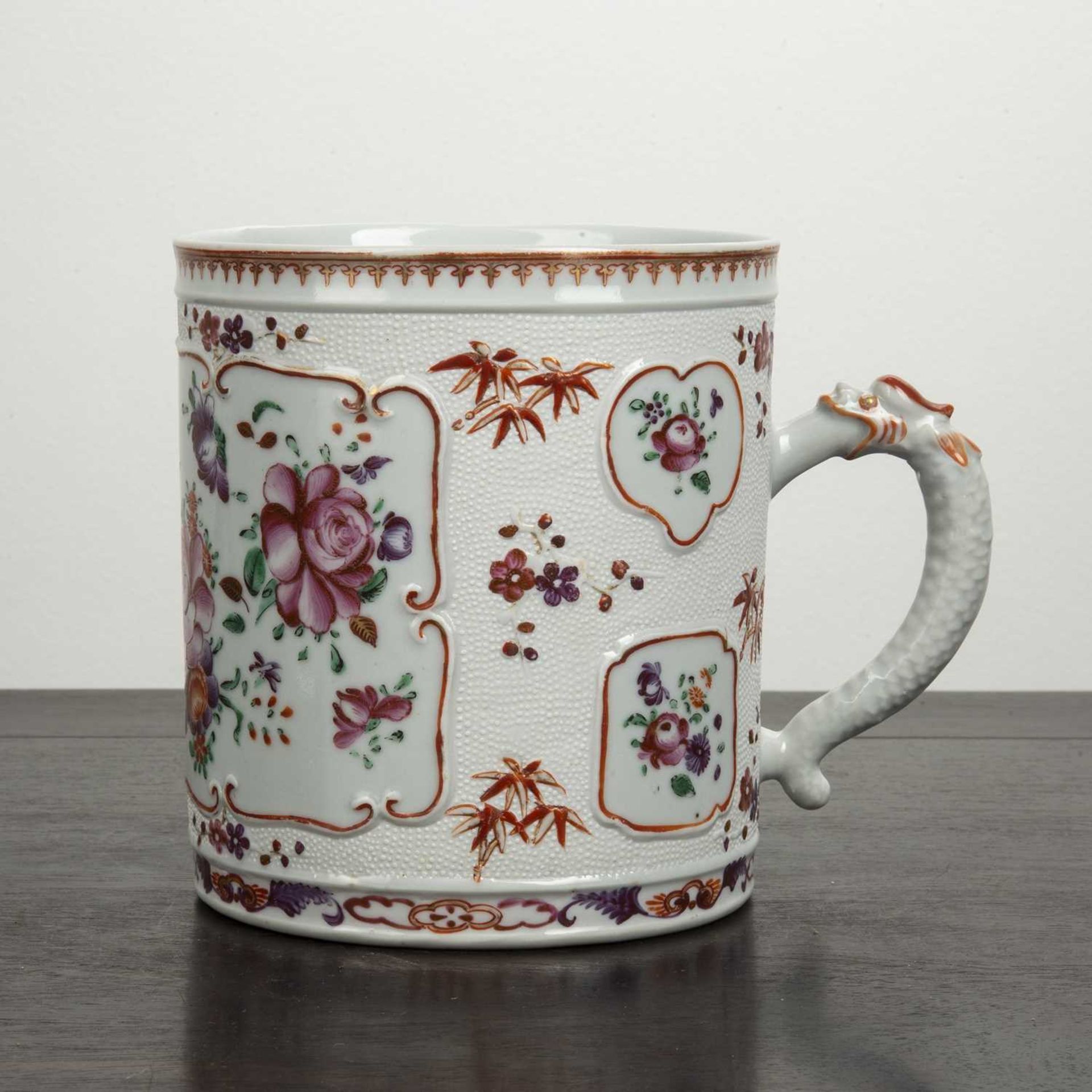 Large famille rose tankard Chinese with raised decoration separated by floral medallions, the