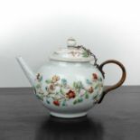 White ground porcelain ovoid teapot Chinese, 18th Century with a trailing band of raised fruit and