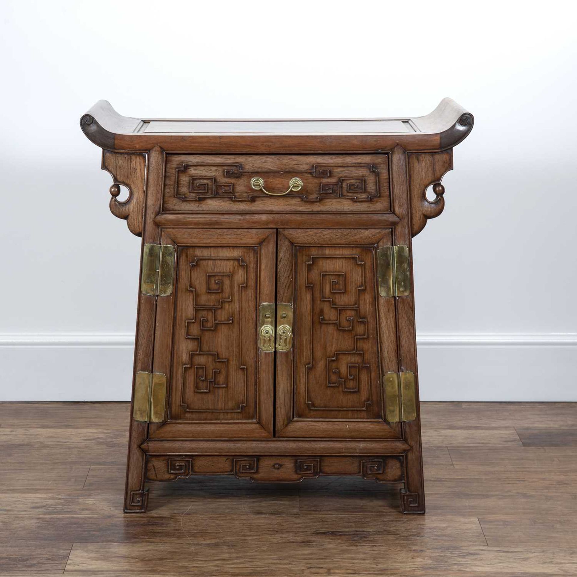 Carved 'Ming' style cabinet Chinese, 19th Century fitted with a drawer and cupboards below, and with