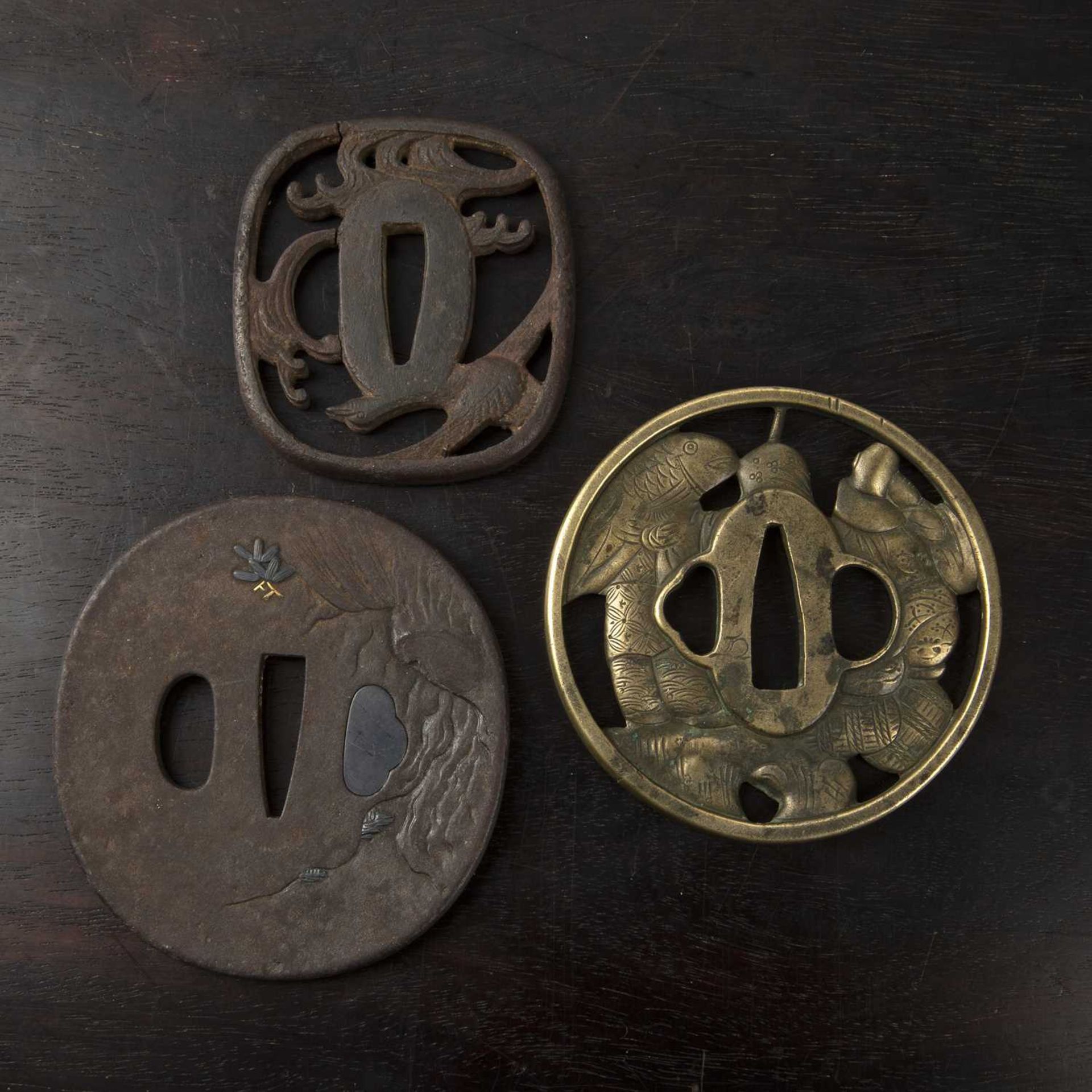 Three tsubas Japanese, 18th/19th Century to include a sentoku tsuba depicting two figures from - Image 2 of 4