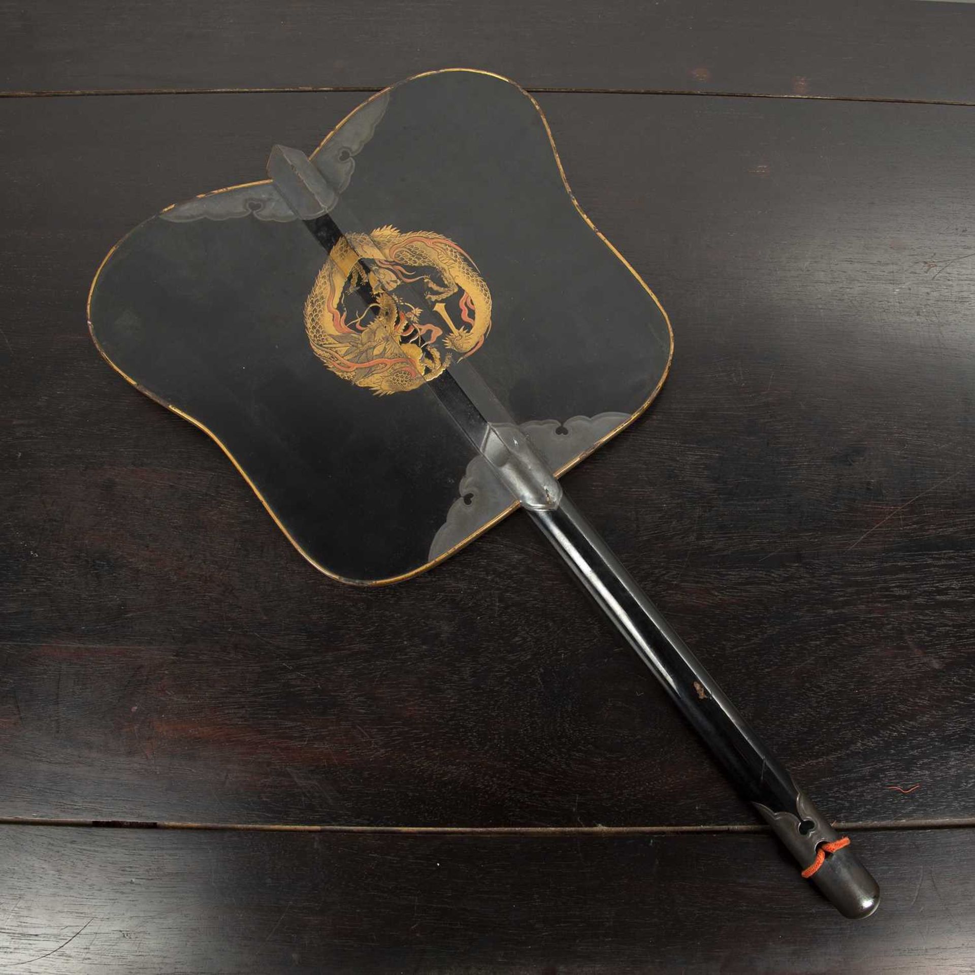 Black lacquer and hiramaki-e fan (gunbai uchiwa) Japanese, Meiji period with dragon design to one