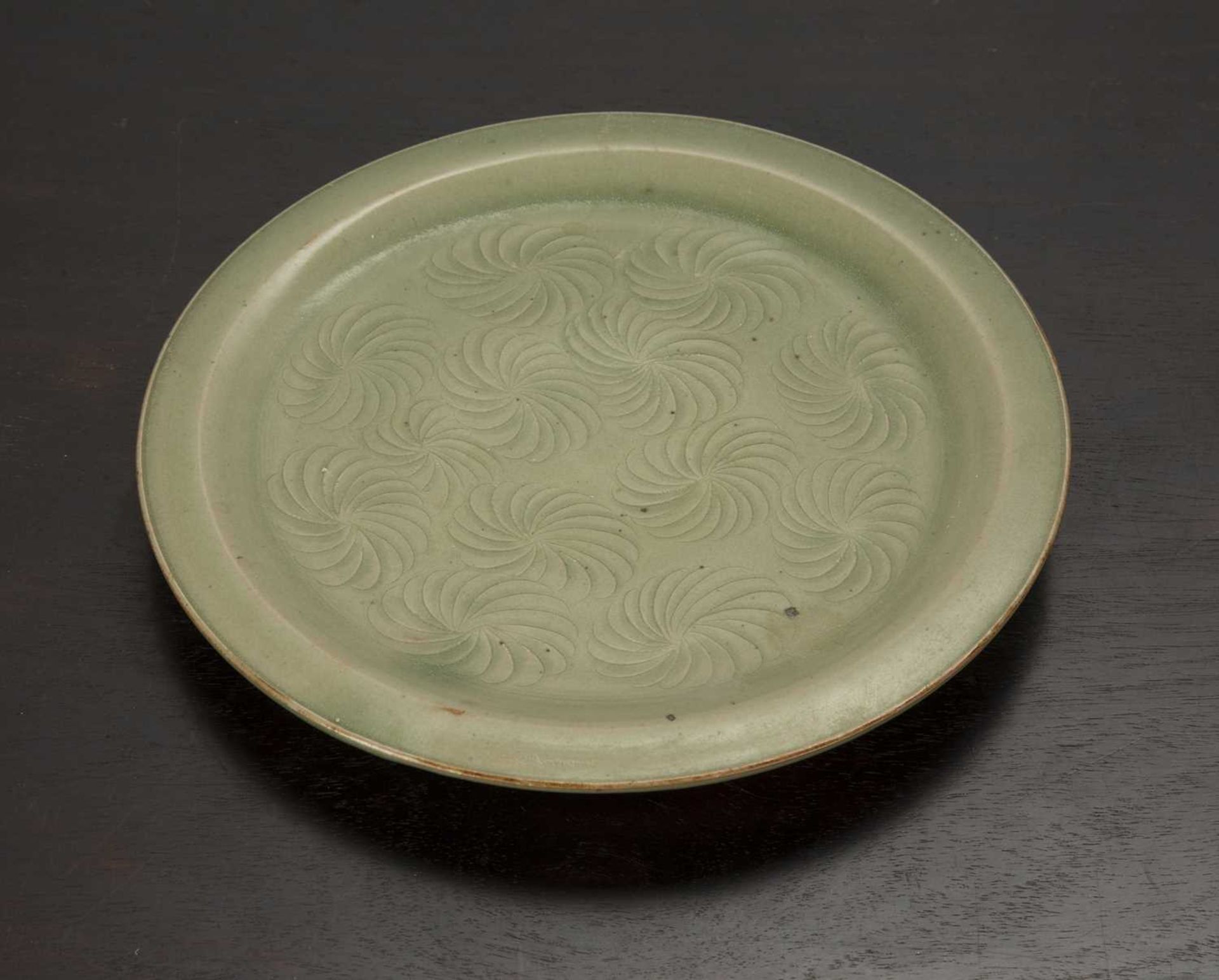 Celadon plate Chinese decorated with concentric style decoration to the centre, 19.5cm acrossAt