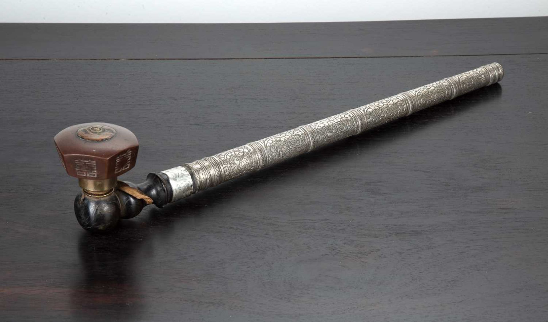 Opium pipe Thailand, early 20th Century with tapering white metal engraved stem, and with