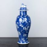 Blue and white lidded prunus vase Chinese, 19th Century decorated with flowering branches, the lid