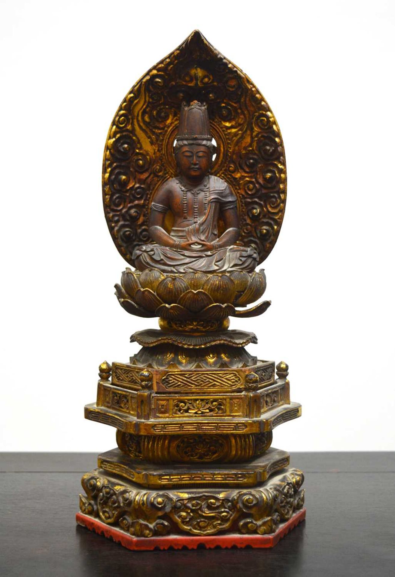 Giltwood buddha Korean sat on a lotus base, perched on an elaborate throne, with a cloud backing,