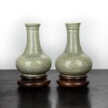Pair of Koryu celadon vases Korean, 12th-14th Century of bulbous pear shape, the bodies engraved