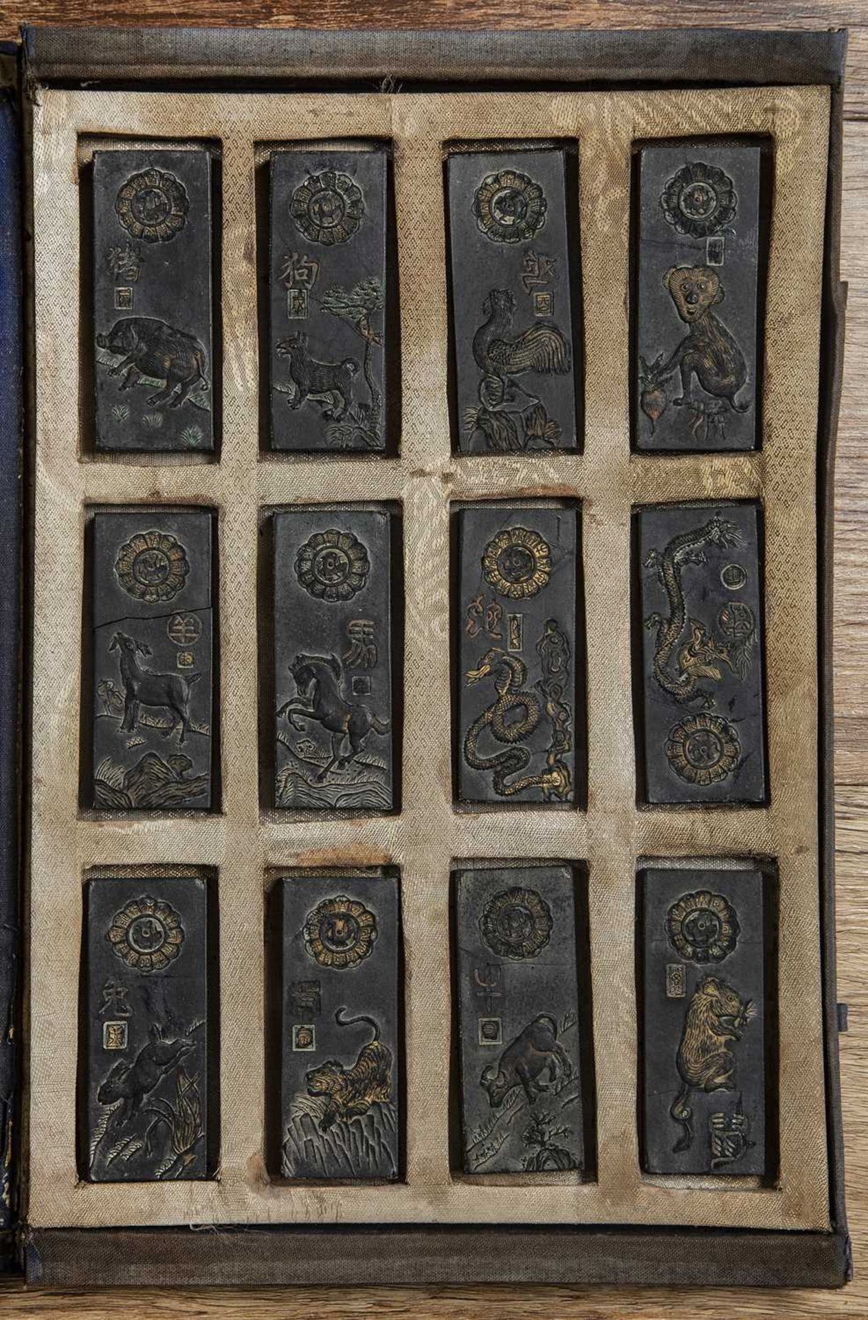 Cased set of ink blocks Chinese the 12 ink blocks represent signs of the Zodiac, case 32cm x 22.5cm,