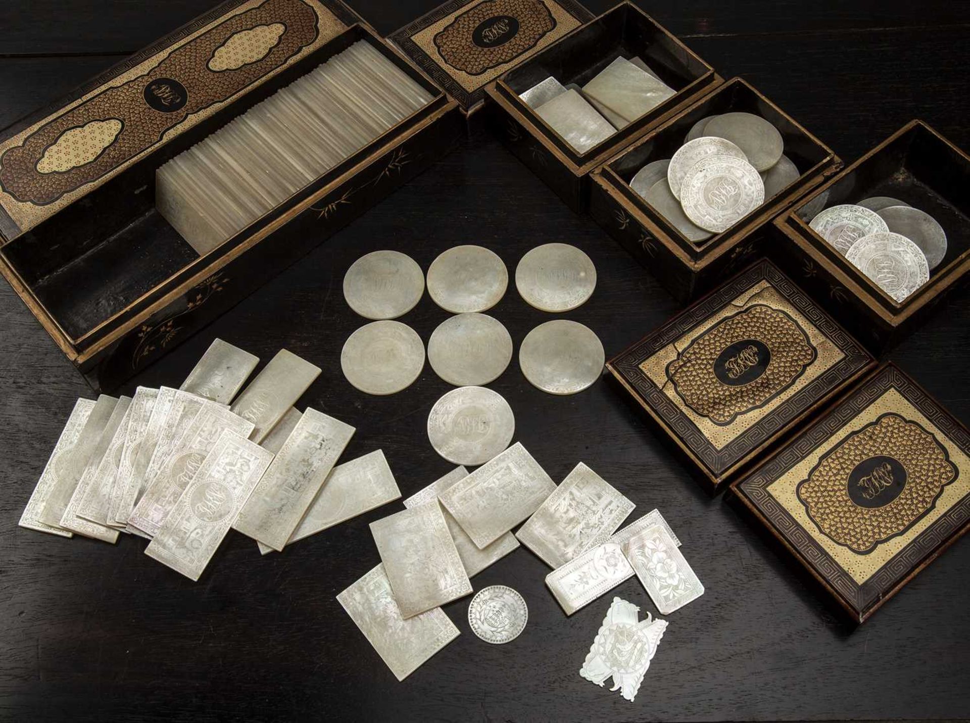 Collection of mother-of-pearl gaming counters and lacquer boxes and trays Chinese, 19th Century with