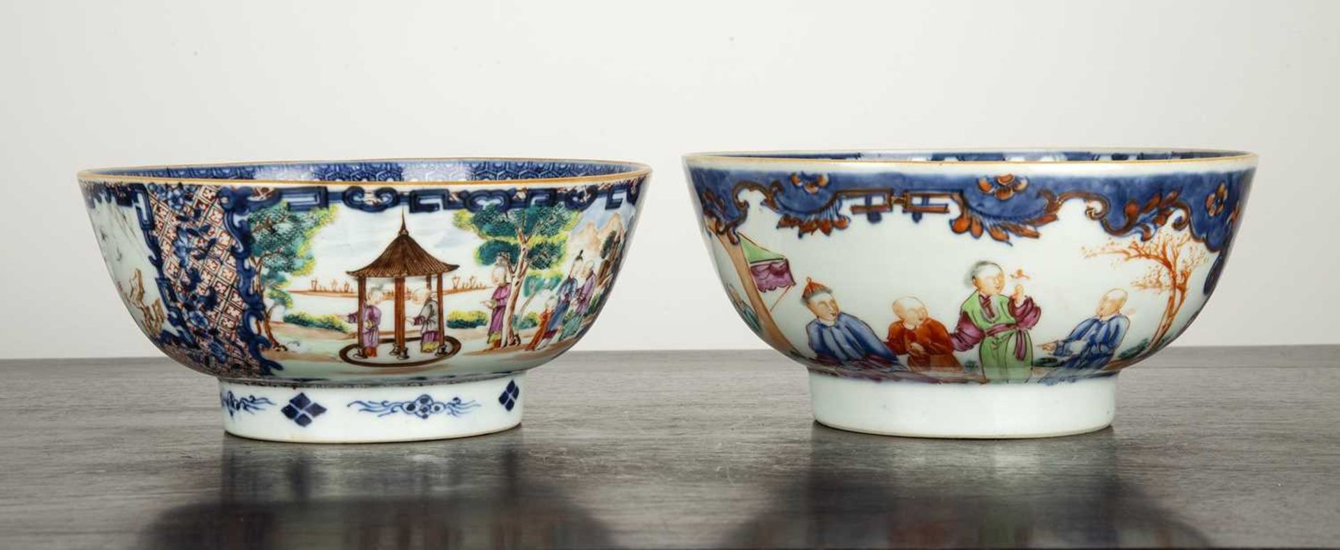 Two Mandarin porcelain bowls Chinese, late 18th Century each painted with panels of figures and